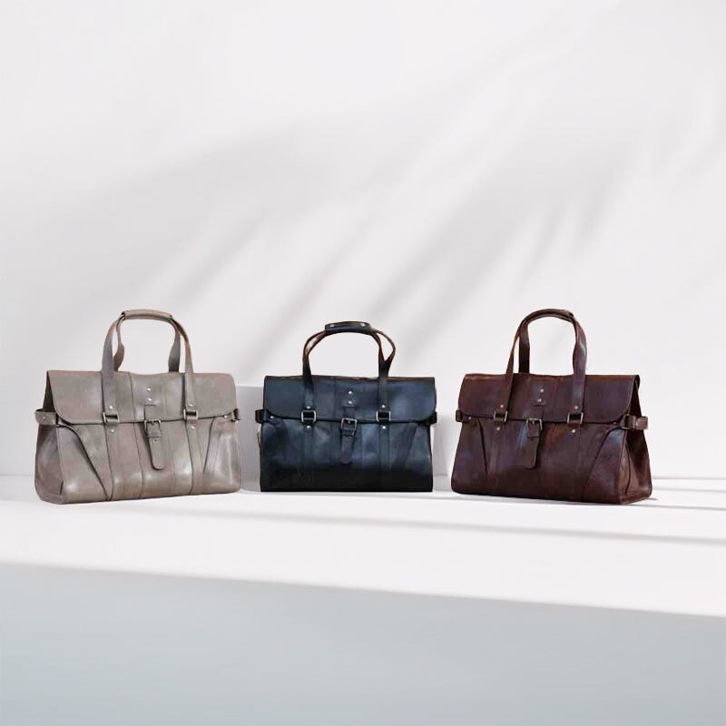Handmade vegetable-tanned leather briefcase in black, coffee, and gray 