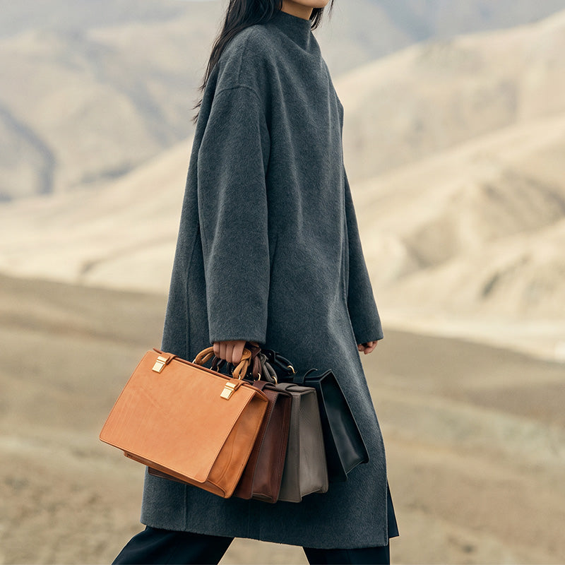Vegetable tanned leather briefcase with top handle and buckle straps, structured work bag for women
