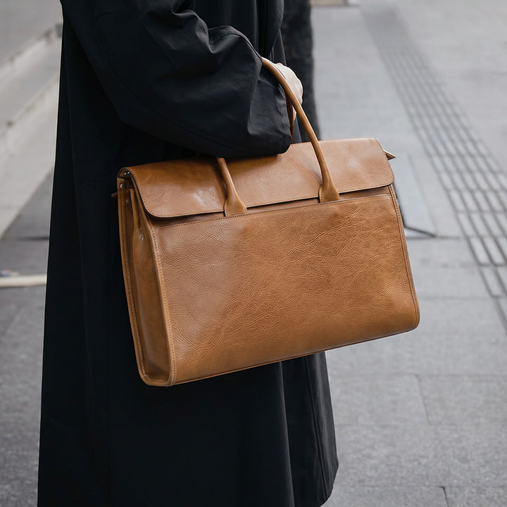Large vegetable tanned leather briefcase with double top handles, fits 15.6" laptop, in brown