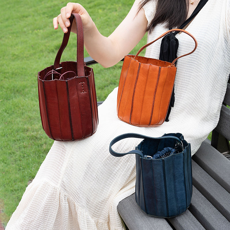 Handcrafted vegetable tanned leather bucket bag with vertical panel stitching