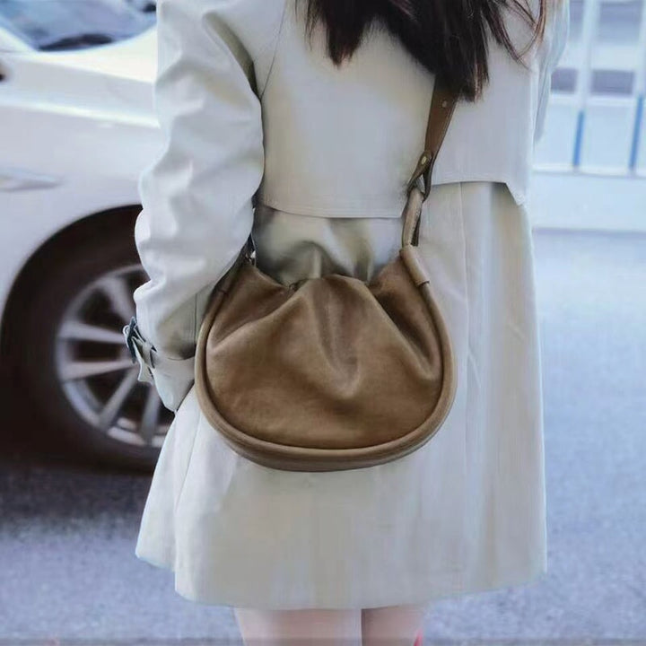 Soft puffy vegetable tanned leather dumpling bag in avocado