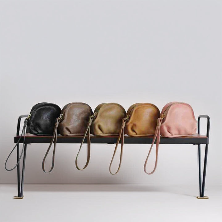 Vegetable tanned leather zipper pouch in multiple colors as a compact coin purse organizer