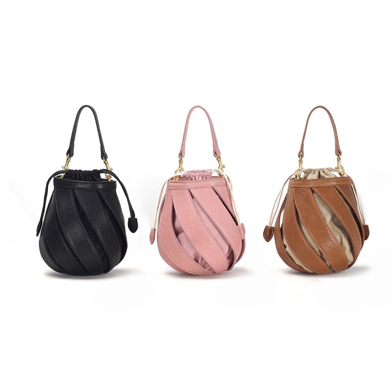 Handmade woven leather bucket bag for women in black, pink, and apricot with drawstring closure