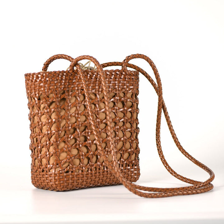 Handwoven leather bucket bag in brown with braided crossbody strap