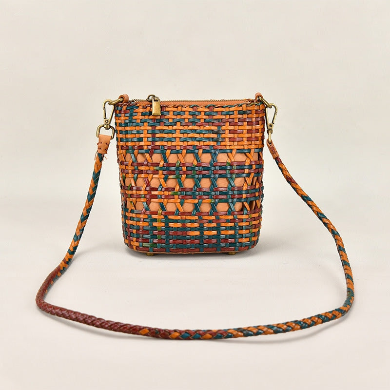 Handmade woven leather crossbody bag in multicolor boho weave with braided strap and brass zip closure