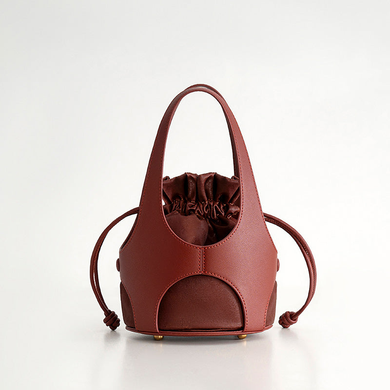 Red oracle bone script silk drawstring bucket bag with cowhide leather trim
