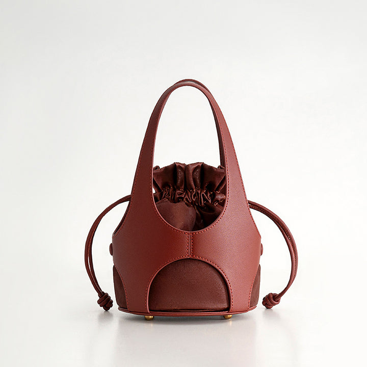 Red oracle bone script silk drawstring bucket bag with cowhide leather trim