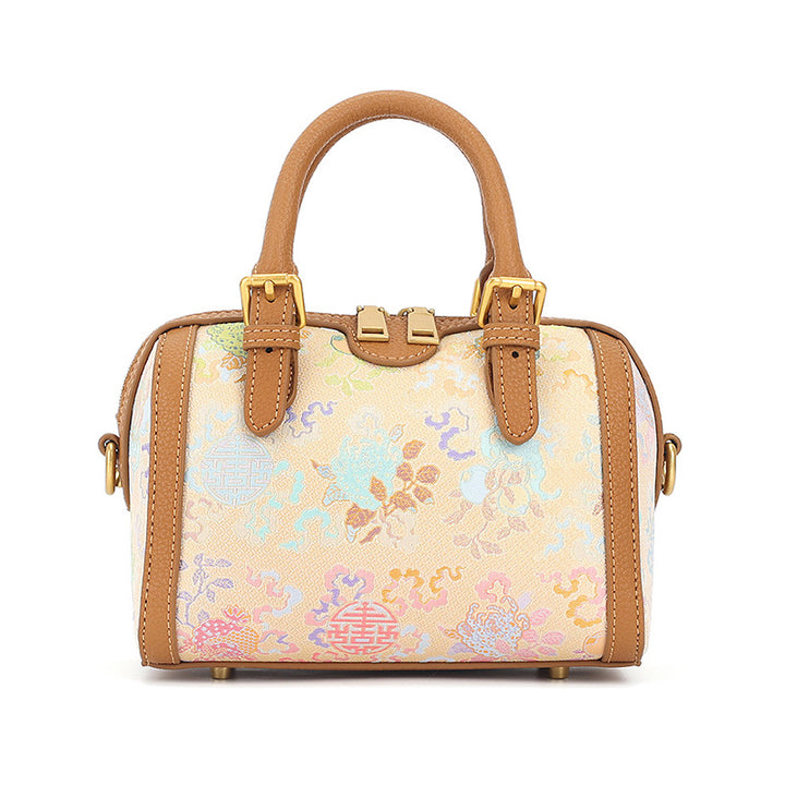 Yellow cowhide Boston bag with Song Brocade Sanduo motif