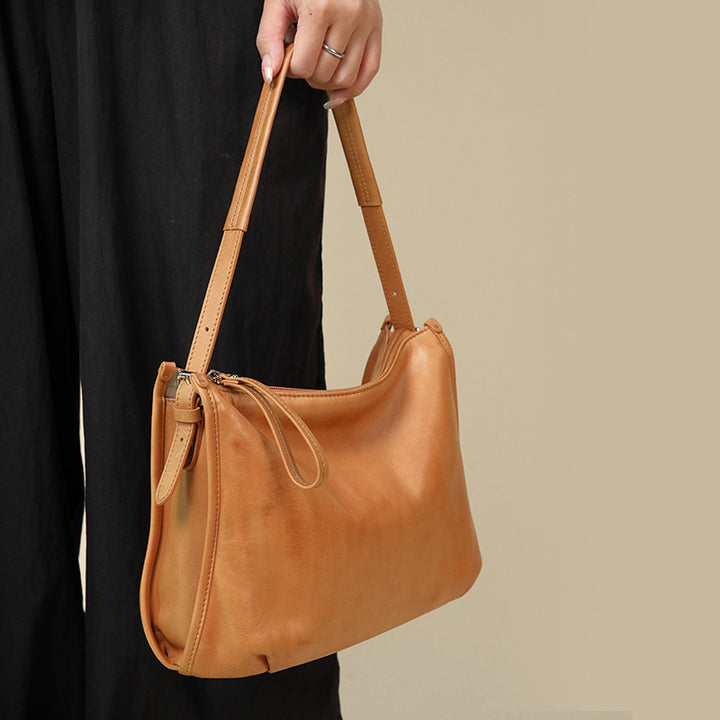 Yellow top grain leather crossbody bag with adjustable shoulder strap